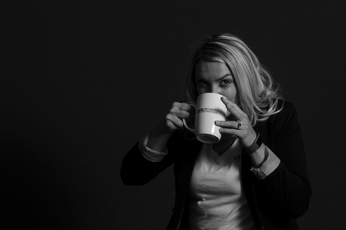 Life Start instructor with coffee mug